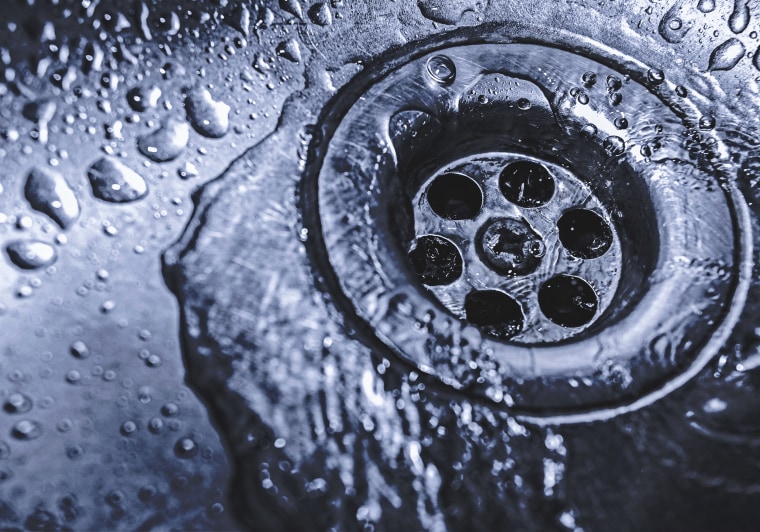 Image: Water goes down a sink drain